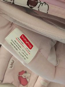 Baby nest with pillows and mosquito net