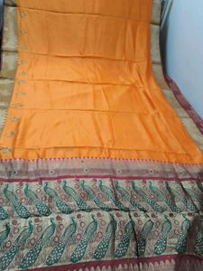 Beautiful Orange Silk Saree with Peacock Border