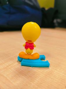 Cute Tweety Bird Toy Figure holding pink bag pack,