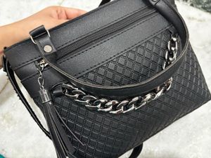 Chic Black Handbag with Chain Detail