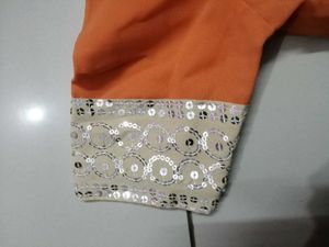 Elegant Orange Saree with Embellished Border