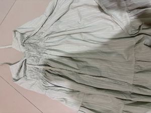 Safe green tiered babydoll mini dress