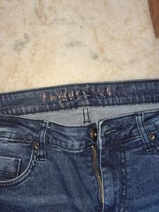 Distressed Denim Jeans with Plaid Detail