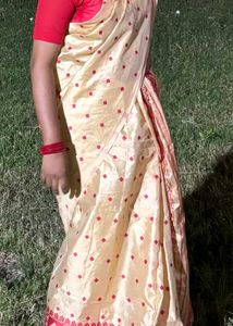Elegant Cream Saree with Red Motifs