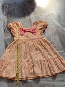 Cute Peach Dress with Pink Bow