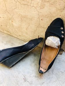black platform with stone