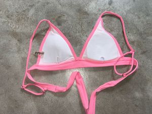 tri-bralette style bikini top and pink bot