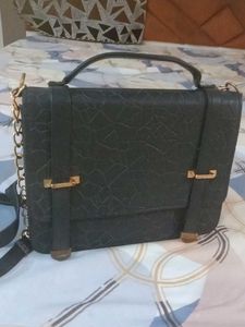 Chic Black Satchel Bag with Gold Accents