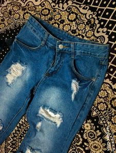 Distressed Blue Denim Jeans