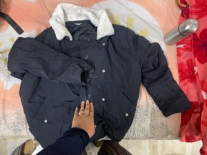 Black Puffer Jacket Had Adjustable Knot At The
