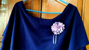 Elegant Navy Blue Tiered Blouse with Flower Accent