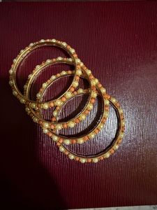 Heart Dangle Earrings and pearl bangles.