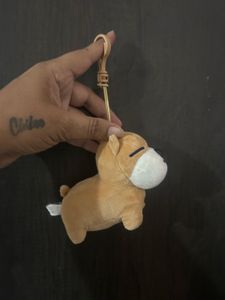 brown plush dog bag charm/keyring with a sleeping
