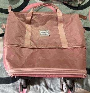 Durable Pink Rolling Travel Bag