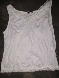 white hand stitched sleeves top