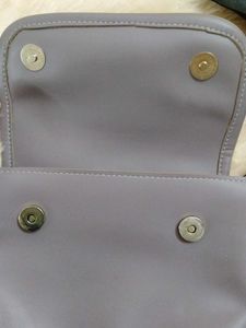 Stylish lavender crossbody bag with coin purse