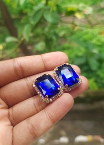 Classic Sapphire Earrings With Diamonds Around It