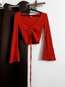 rust orange flared sleeve top
