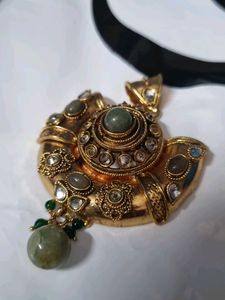 Designer Gold Tone Pendant with Green Stones