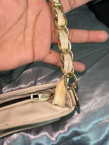 Elegant Cream Handbag with Gold Chain
