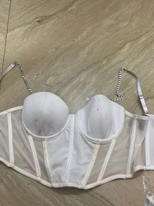 white corset top with silver chain detailing