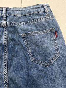 Distressed Blue Denim Jeans