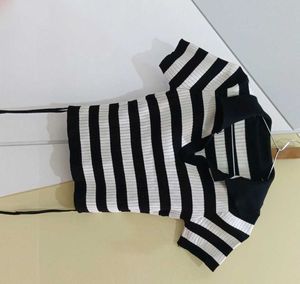 a black and white striped streetwear top. basic we