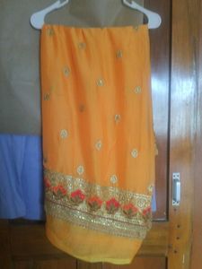 Vibrant Orange Saree with Embellishments