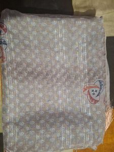Elegant Beige Saree with Intricate Pattern