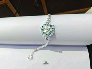 Elegant Pure Silver Rakhi with Blue Stones