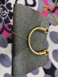 Sparkling Black Clutch with Gold Embellishments