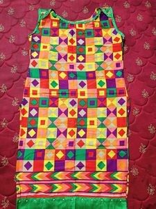 Multi Coloured Cotton Kurti With Pearls Attached On The Neck And Bottom Part.