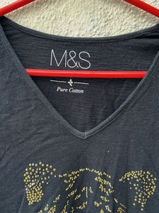 black casual top with embellished tiger imprint