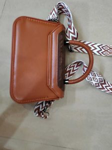Chic Brown Handbag with Trendy Strap