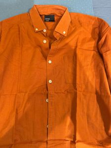 orange shirt from snitch
