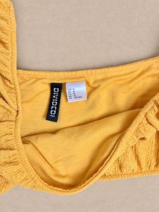 Sunflower yellow textured puff-sleeve crop top
