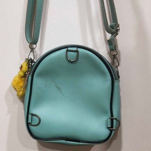 Cute Teal Crossbody Bag with Charm and keychain.