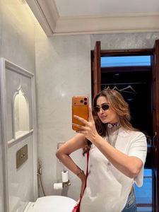 one shoulder white top