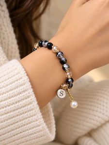 Elegant Beaded Bracelet with Charm