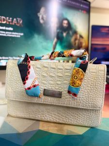 Elegant Shoulder Bag with Scarf Detail