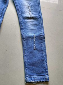 Distressed Blue Denim Jeans
