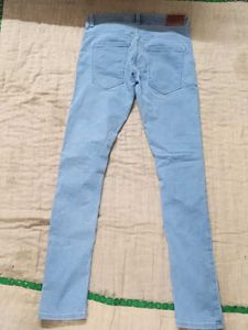 Light Blue Jeans with Graphic Patch