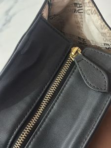 Chic Black Tote Bag with Sunflower Charm