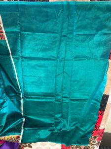 Elegant Teal Saree with Intricate Embroidery
