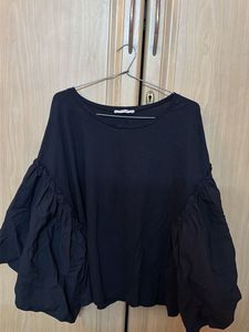 Stylish Black Top with Dramatic Sleeves
