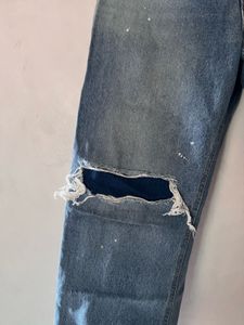 Distressed Blue Denim Jeans