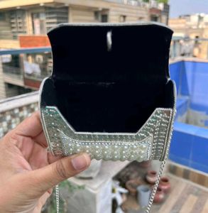 Elegant Pearl Embellished Clutch from Snatcher