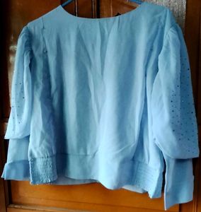 Elegant Light Blue Top with Embellished Sleeve