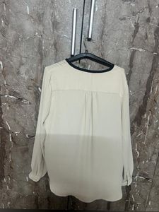 Elegant Cream Top with Black Trim