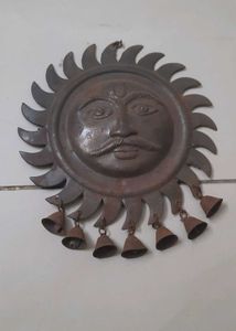 antique sun face decorative wall hanging with bell
